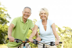 Mature couple riding bikes